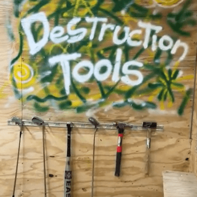destruction tools in a rage room at Asylum Rage Room